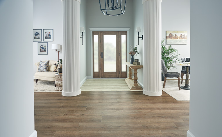 luxury vinyl plank flooring transitioning from room to room