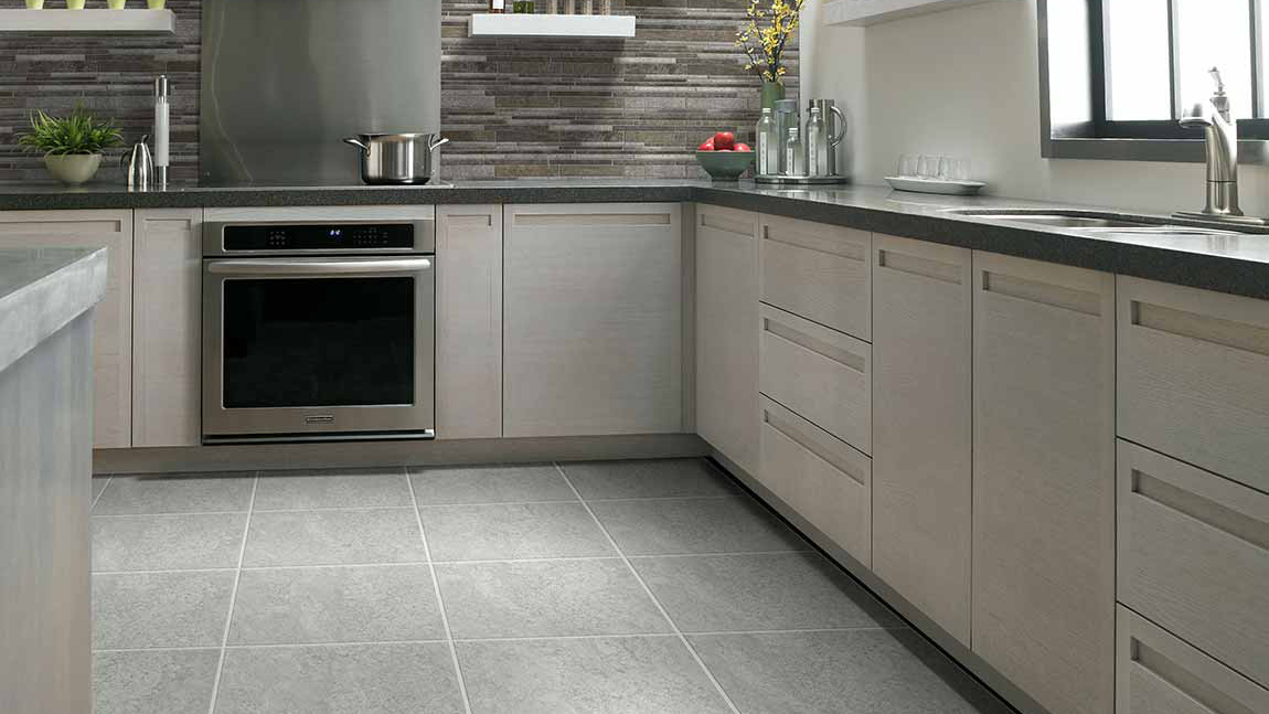 Tile flooring in a kitchen, installation services available.