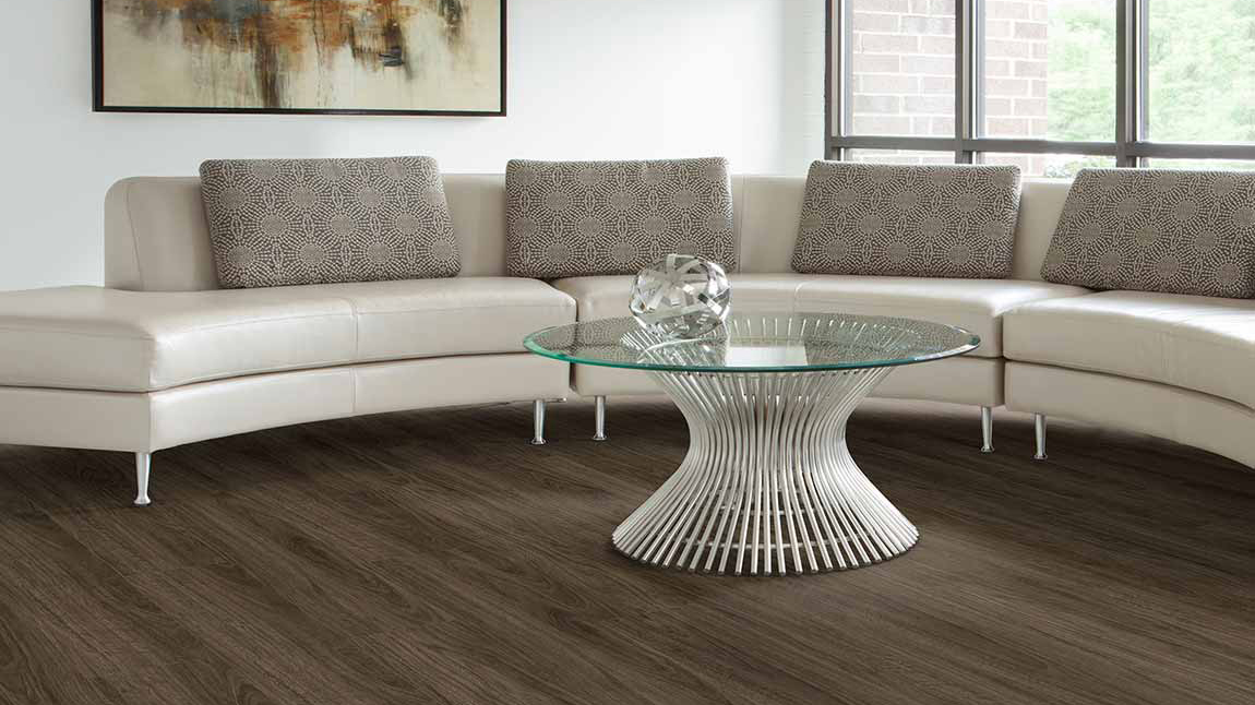 Luxury vinyl flooring in a living room, installation services available. 